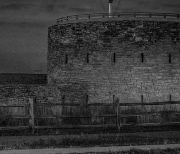 Round tour at Fort Snelling in dark black and white photo